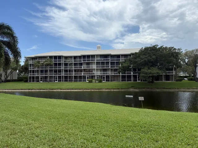 a view of a house next to a yard
