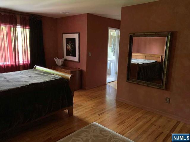 126 Hawthorne Avenue Park Ridge, NJ 07656 - Photo 13 of 22 a bedroom with a bed and a dresser