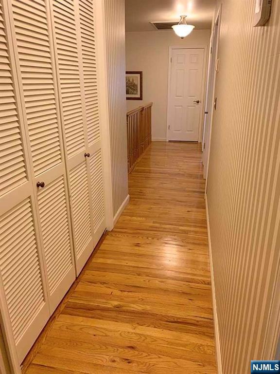 126 Hawthorne Avenue Park Ridge, NJ 07656 - Photo 16 of 22 a view of a hallway with wooden floor
