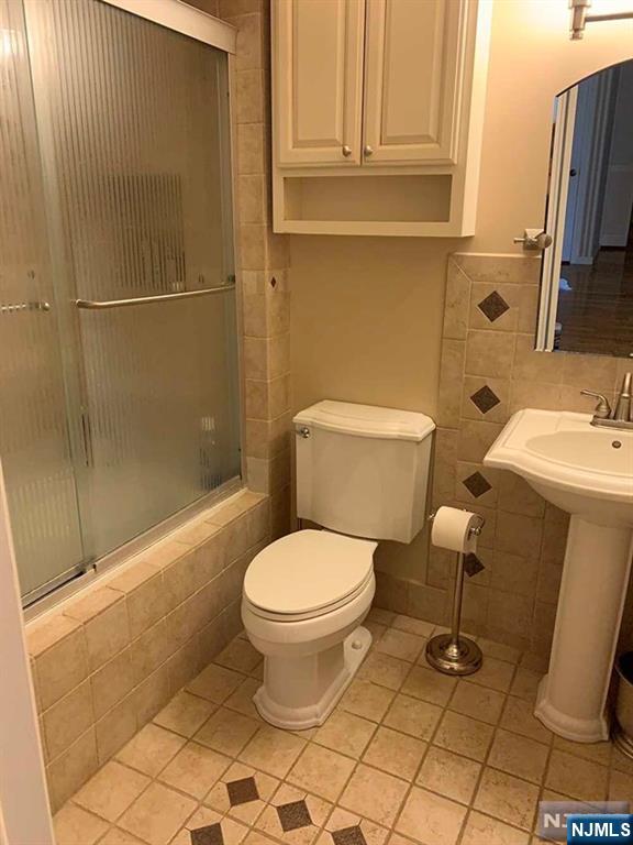 126 Hawthorne Avenue Park Ridge, NJ 07656 - Photo 17 of 22 a bathroom with a toilet and a shower