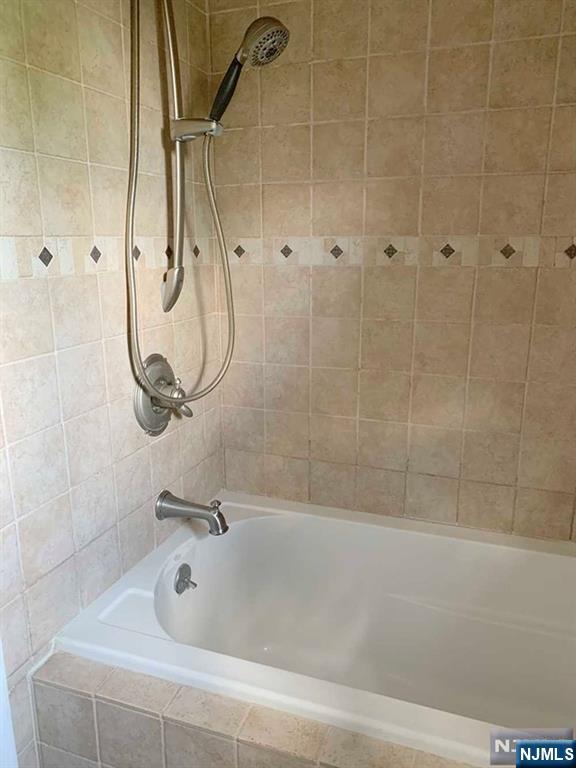 126 Hawthorne Avenue Park Ridge, NJ 07656 - Photo 18 of 22 a bathroom with a bath tub and a shower
