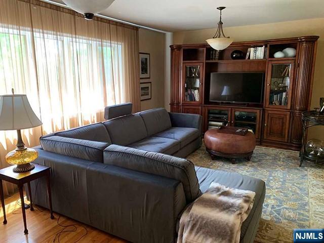 126 Hawthorne Avenue Park Ridge, NJ 07656 - Photo 4 of 22 a living room with furniture and a flat screen tv
