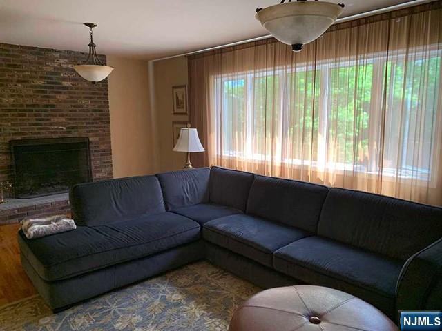 126 Hawthorne Avenue Park Ridge, NJ 07656 - Photo 5 of 22 a living room with furniture and a fireplace