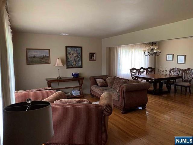 126 Hawthorne Avenue Park Ridge, NJ 07656 - Photo 7 of 22 a living room with furniture and a large window