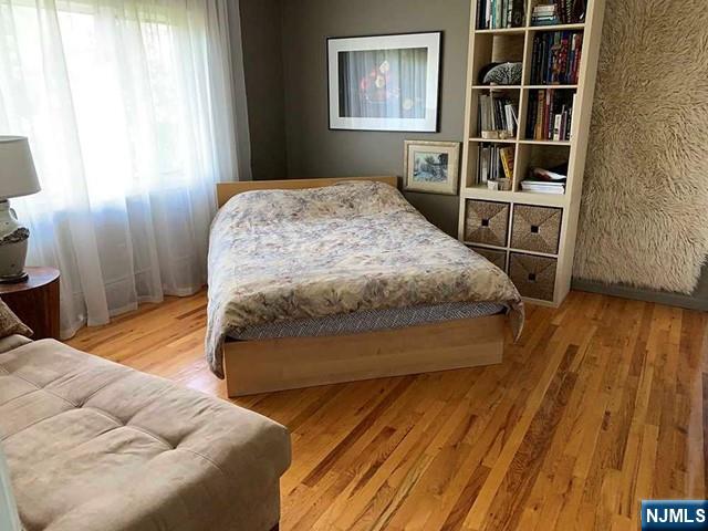 126 Hawthorne Avenue Park Ridge, NJ 07656 - Photo 8 of 22 a bedroom with a bed and a window