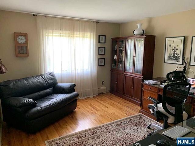126 Hawthorne Avenue Park Ridge, NJ 07656 - Photo 9 of 22 a living room with furniture and a window