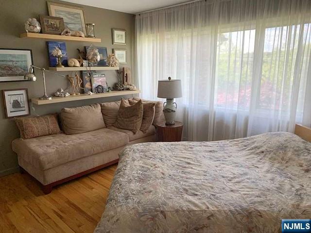 126 Hawthorne Avenue Park Ridge, NJ 07656 - Photo 10 of 22 a living room with furniture and a large window