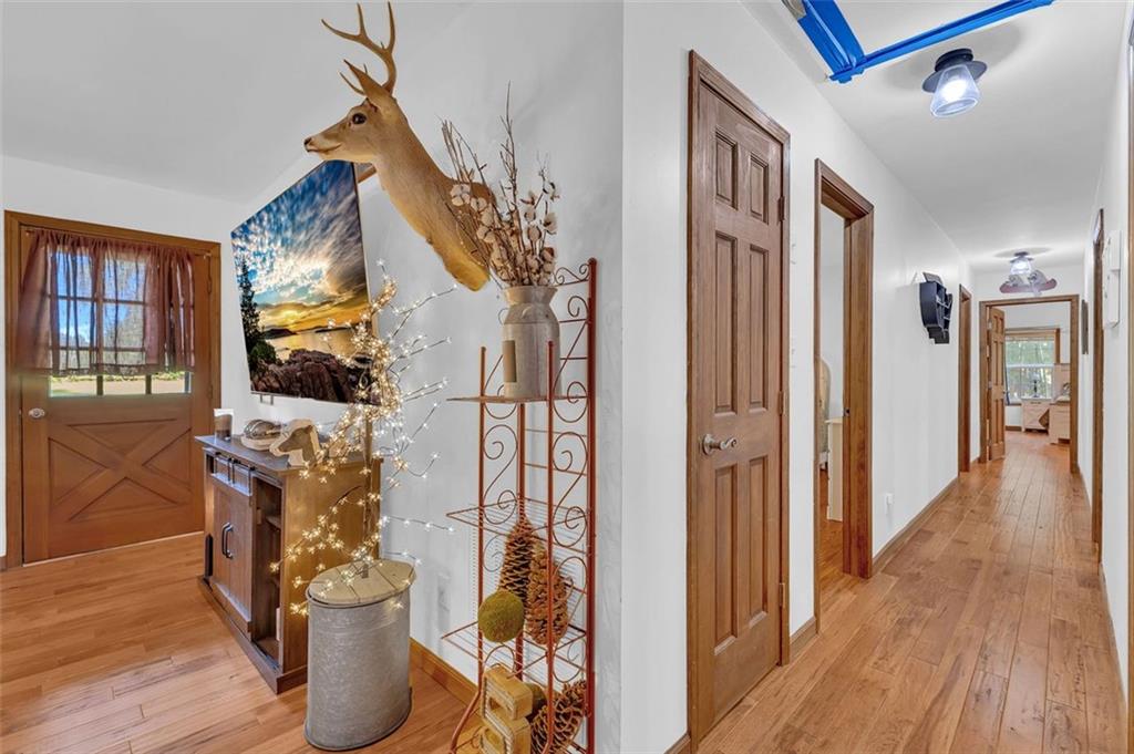 340 Tom Bell Road Milner, GA 30257 - Photo 14 of 34 a view of entryway and hall with wooden floor