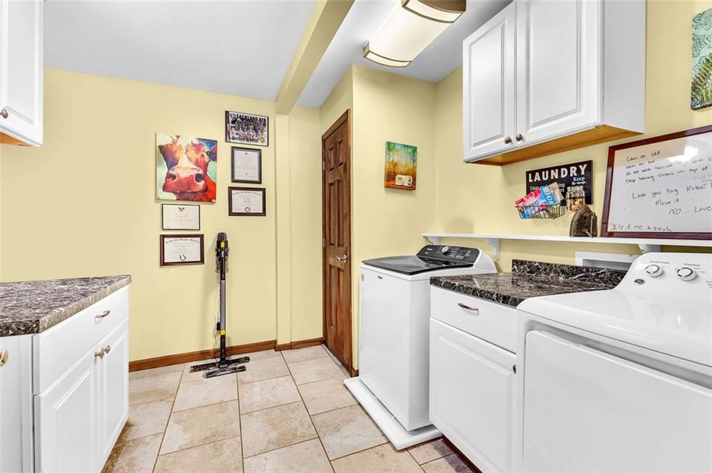340 Tom Bell Road Milner, GA 30257 - Photo 15 of 34 a kitchen with a sink stove and cabinets