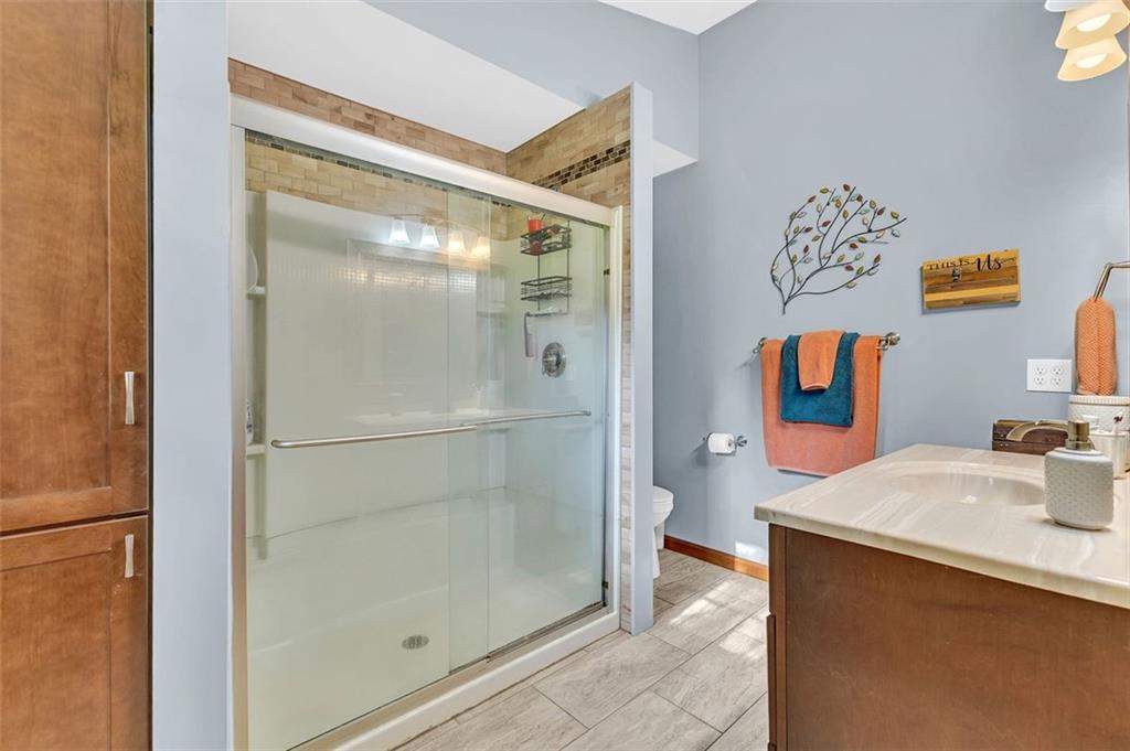 340 Tom Bell Road Milner, GA 30257 - Photo 22 of 34 a bathroom with a sink and a mirror