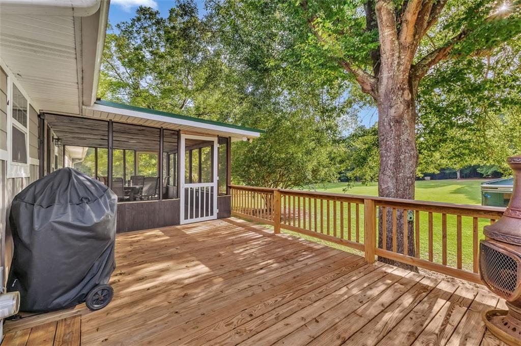 340 Tom Bell Road Milner, GA 30257 - Photo 26 of 34 a view of a two chairs with wooden floor