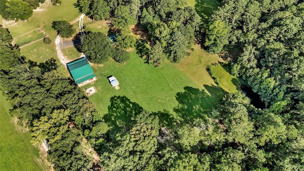 340 Tom Bell Road Milner, GA 30257 - Photo 33 of 34 an aerial view of a residential houses with yard