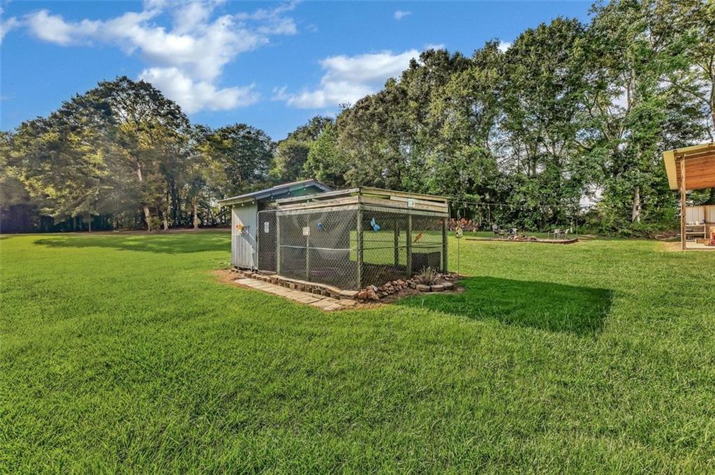 340 Tom Bell Road Milner, GA 30257 - Photo 7 of 34 a view of a house with backyard