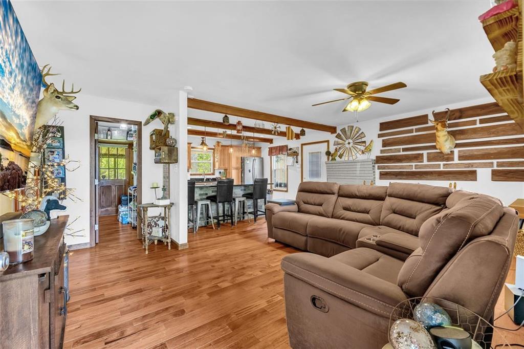 340 Tom Bell Road Milner, GA 30257 - Photo 9 of 34 a living room with furniture and wooden floor