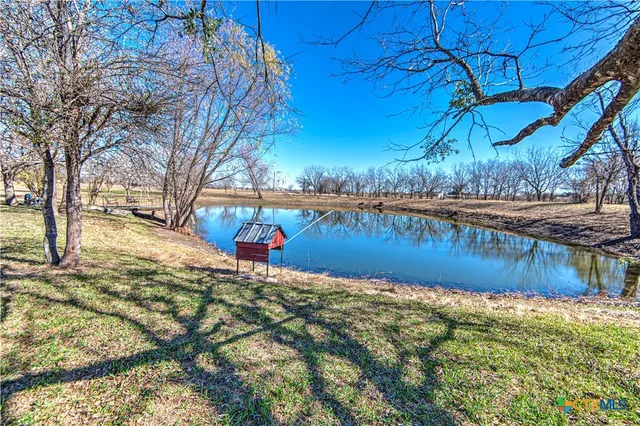 a view of a lake with a yard