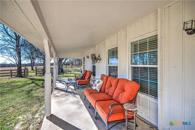 a outdoor living space with patio furniture and garden