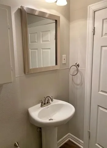 a bathroom with a sink and mirror
