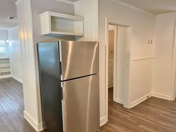 a white refrigerator freezer sitting inside of a kitchen