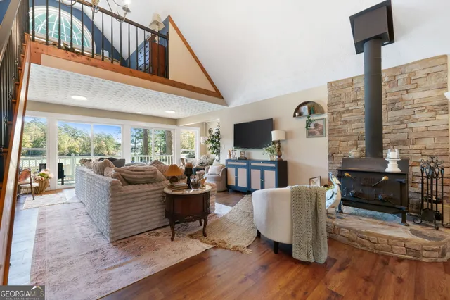 a living room with fireplace furniture and a flat screen tv