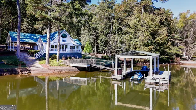 a front view of a house with swimming pool