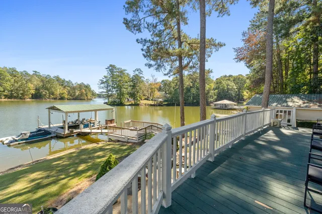 a view of a swimming pool with a lake view