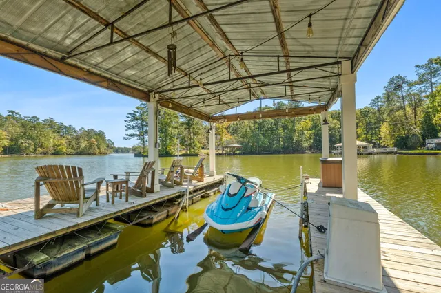 a view of a swimming pool with chairs