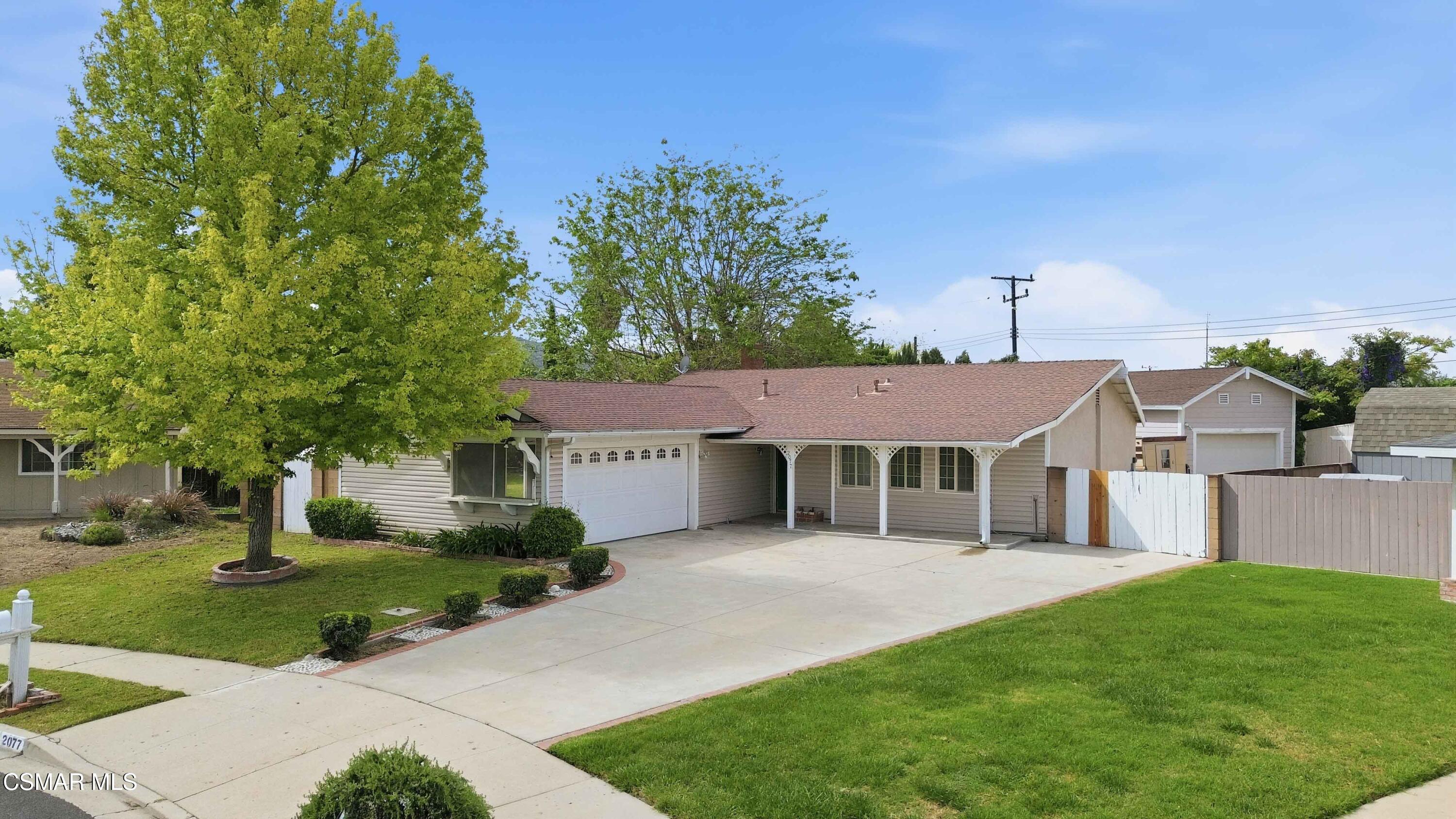 2077 Sebring Court Simi Valley, CA 93065 - Photo 1 of 20 a front view of a house with a yard
