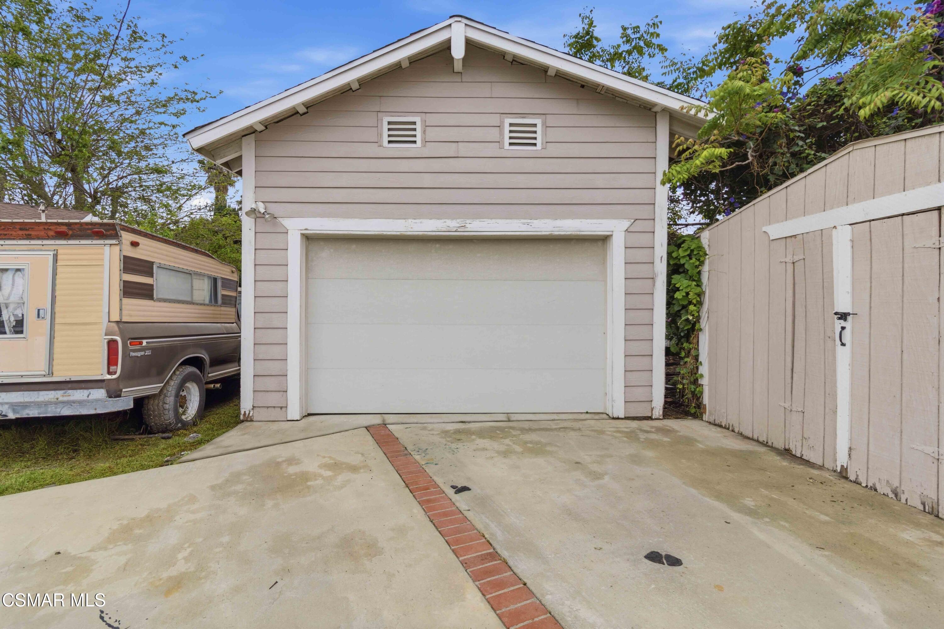 2077 Sebring Court Simi Valley, CA 93065 - Photo 11 of 20 a front view of a house with a garage