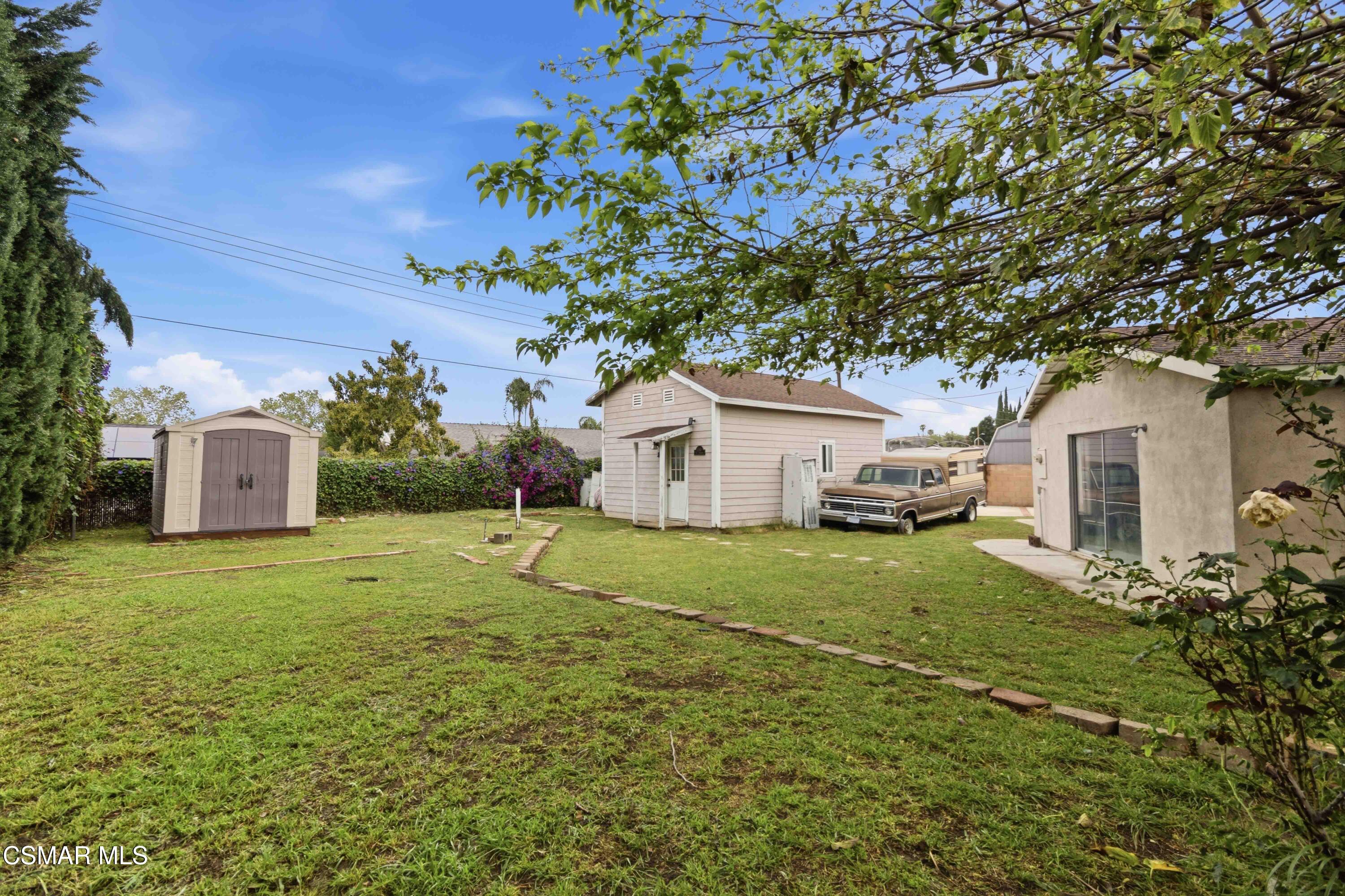 2077 Sebring Court Simi Valley, CA 93065 - Photo 13 of 20 a house with green field in front of it
