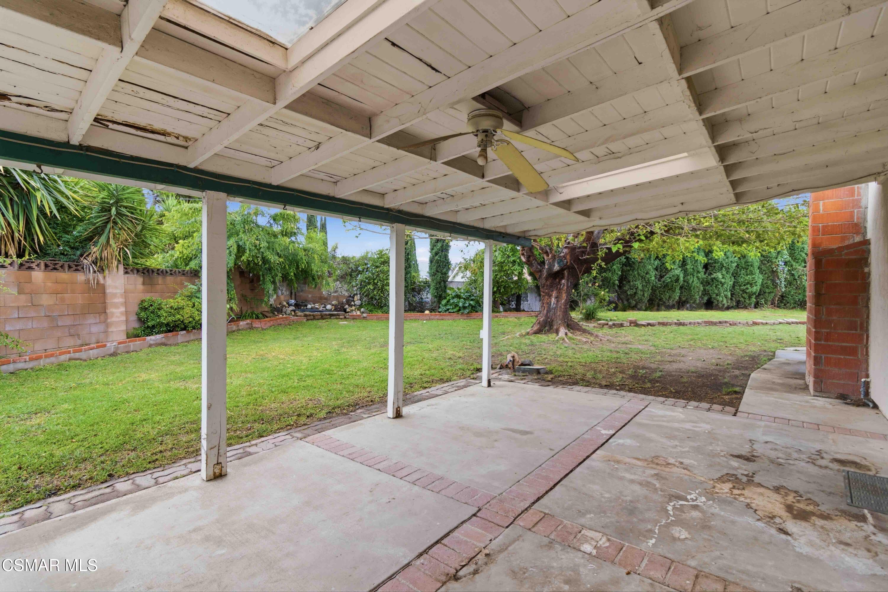 2077 Sebring Court Simi Valley, CA 93065 - Photo 14 of 20 a view of a house with backyard porch and a backyard