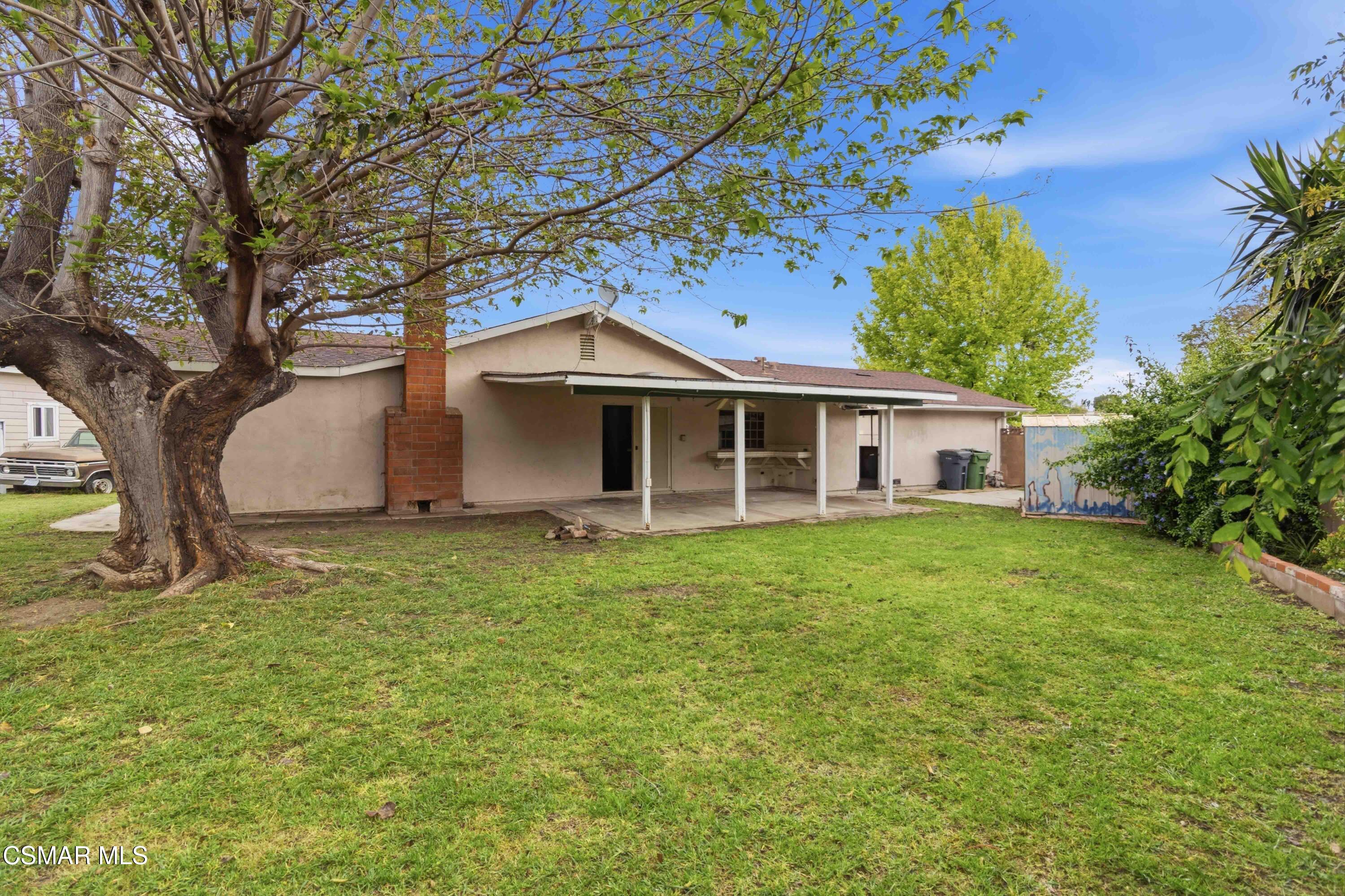 2077 Sebring Court Simi Valley, CA 93065 - Photo 16 of 20 a view of a yard in front of a house with large trees