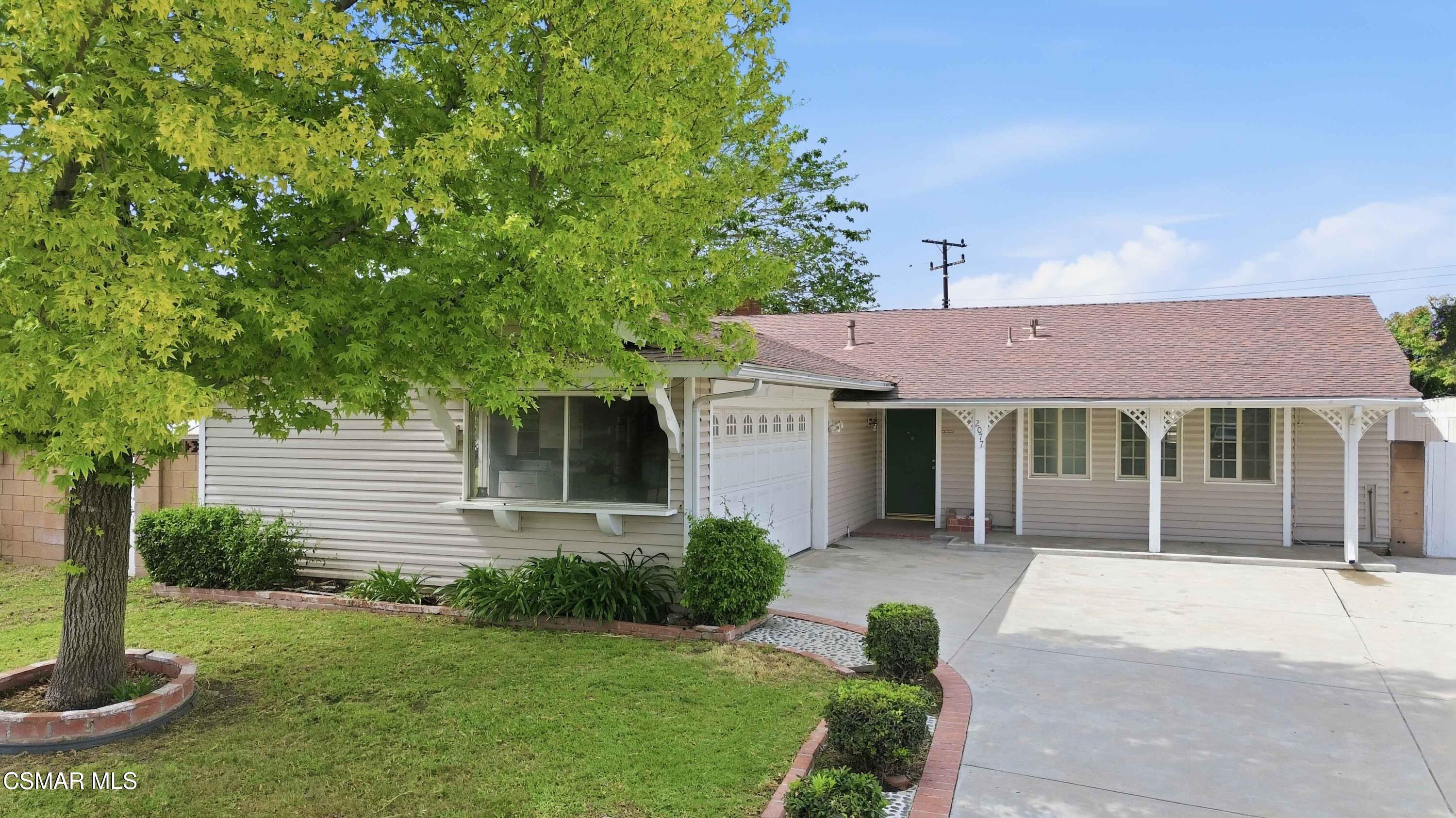 2077 Sebring Court Simi Valley, CA 93065 - Photo 2 of 20 a front view of a house with garden