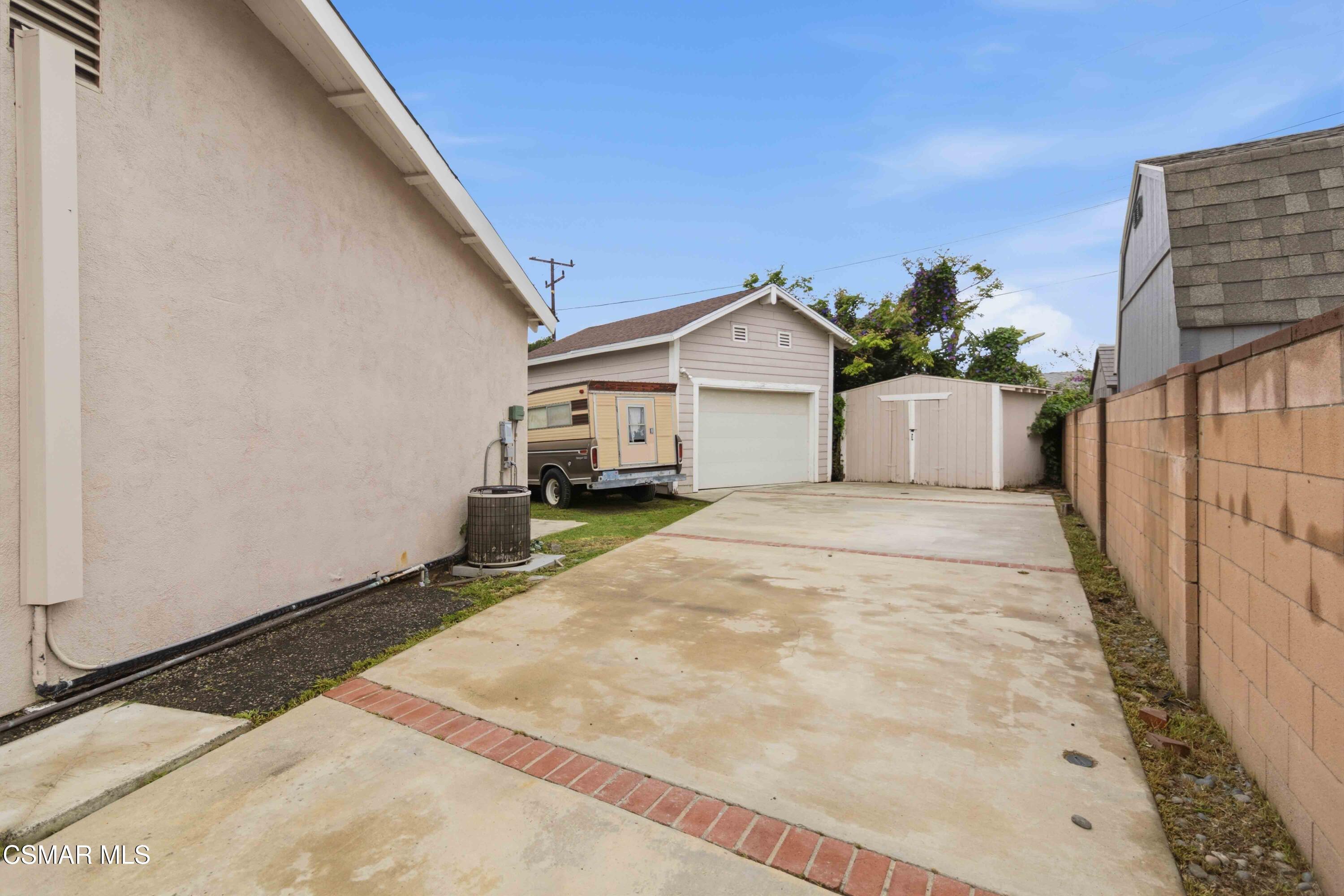 2077 Sebring Court Simi Valley, CA 93065 - Photo 9 of 20 a view of a white house with wooden fence