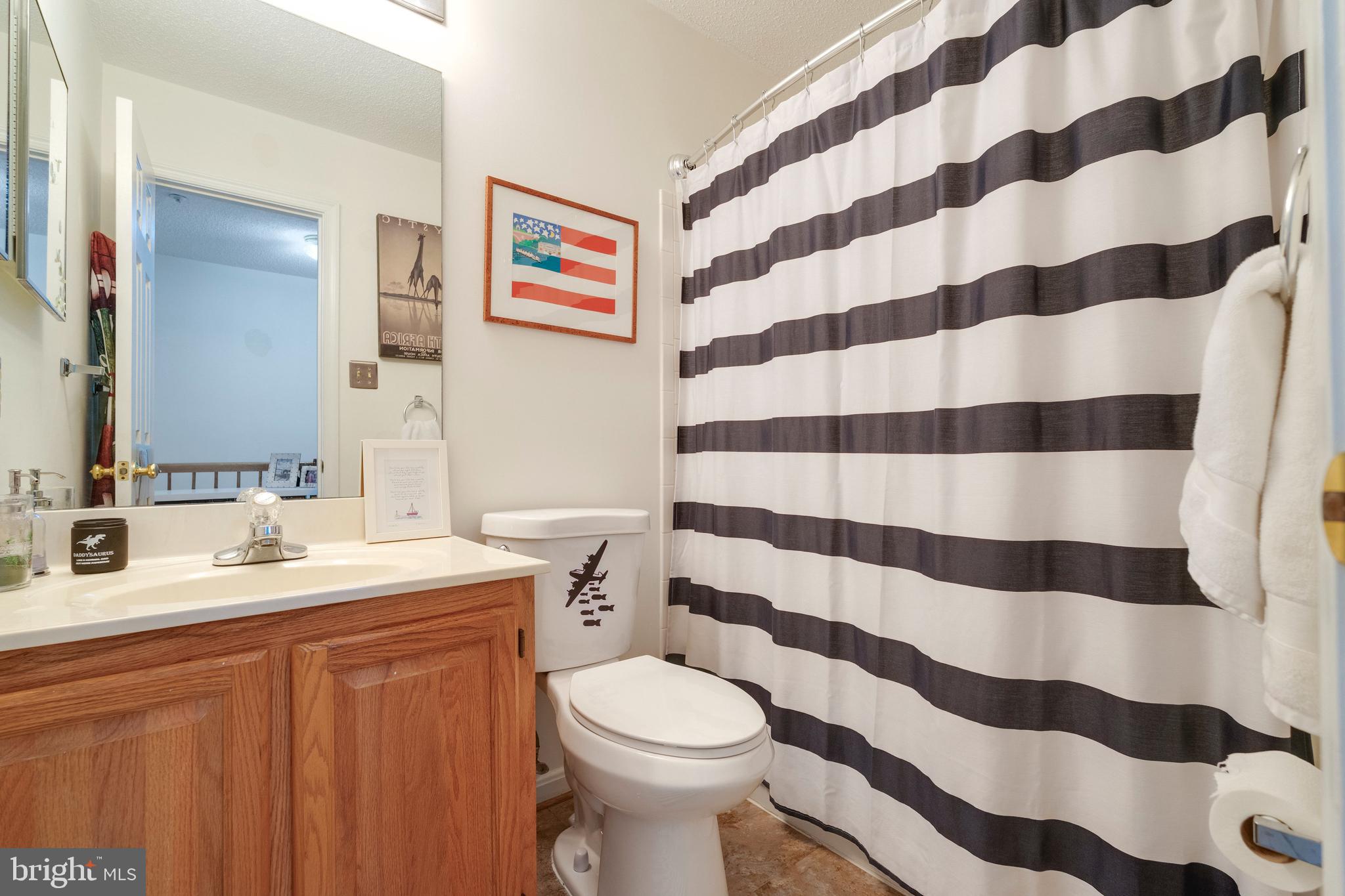 2303 Massanutten Drive Silver Spring, MD 20906 - Photo 17 of 24 a bathroom with a sink toilet and shower