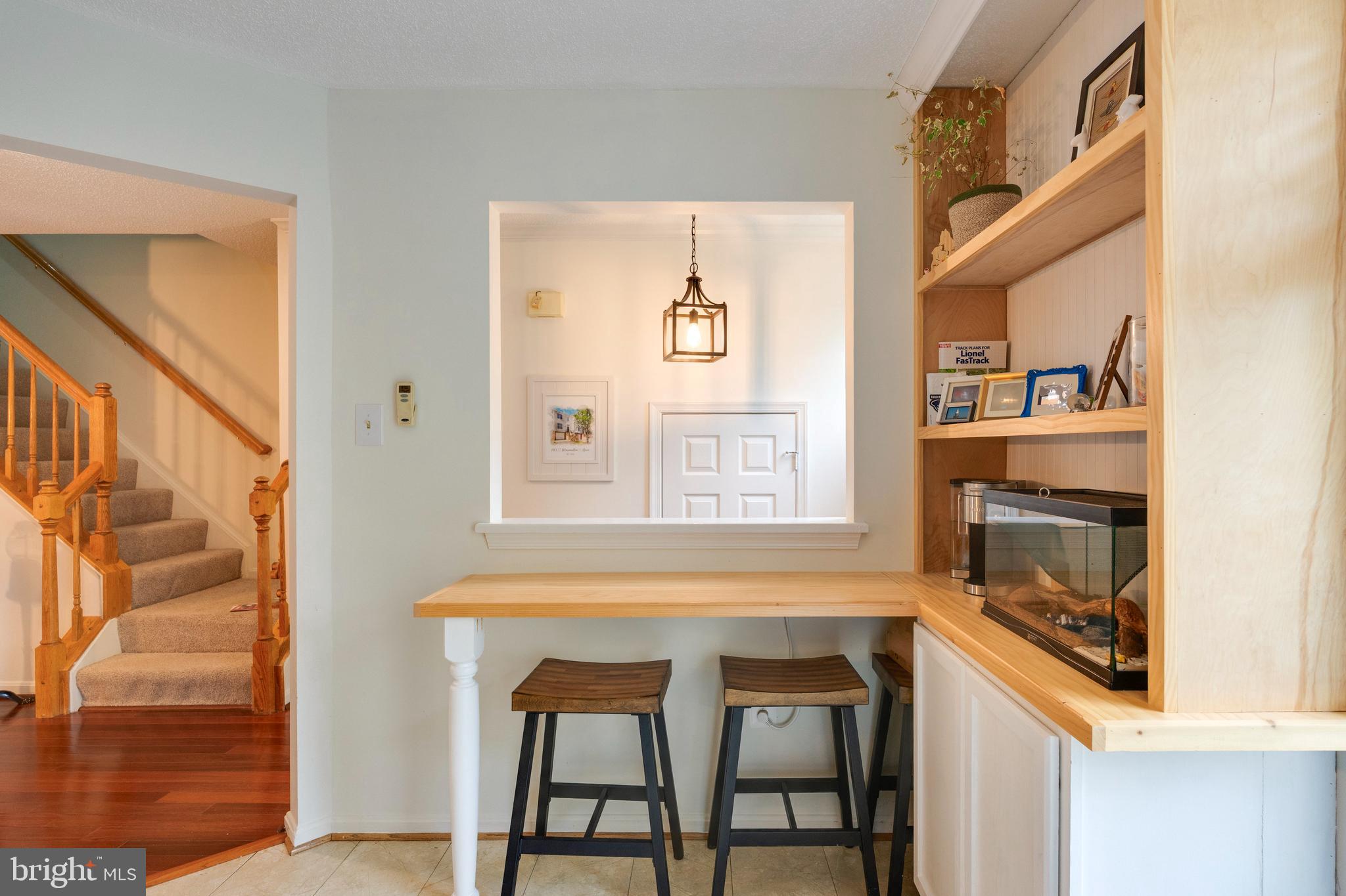2303 Massanutten Drive Silver Spring, MD 20906 - Photo 5 of 24 a living room with a table chairs and a window