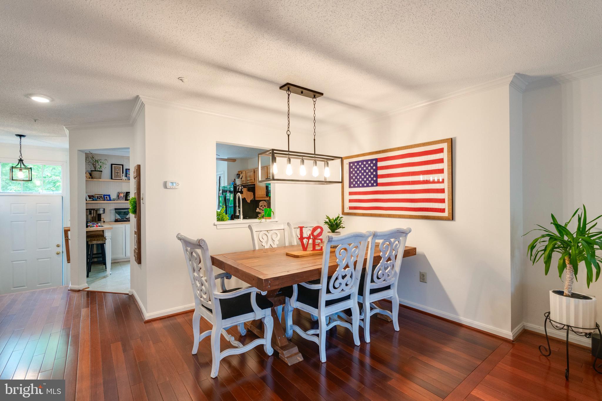 2303 Massanutten Drive Silver Spring, MD 20906 - Photo 10 of 24 a dining room with furniture and wooden floor