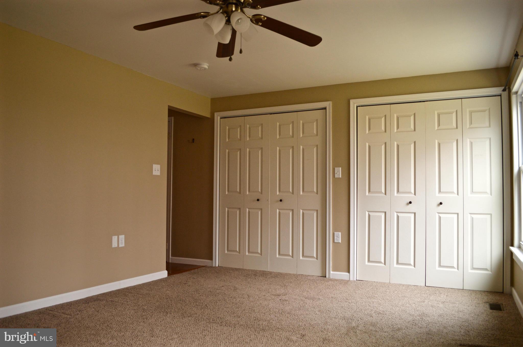 11812 Warner Road Keymar, MD 21757 - Photo 11 of 25 an empty room with a ceiling fan and a window