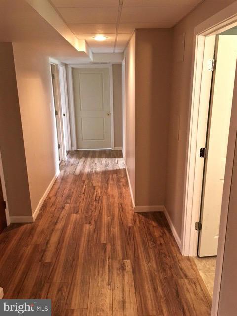 11812 Warner Road Keymar, MD 21757 - Photo 19 of 25 a view of an empty room with wooden floor and a window
