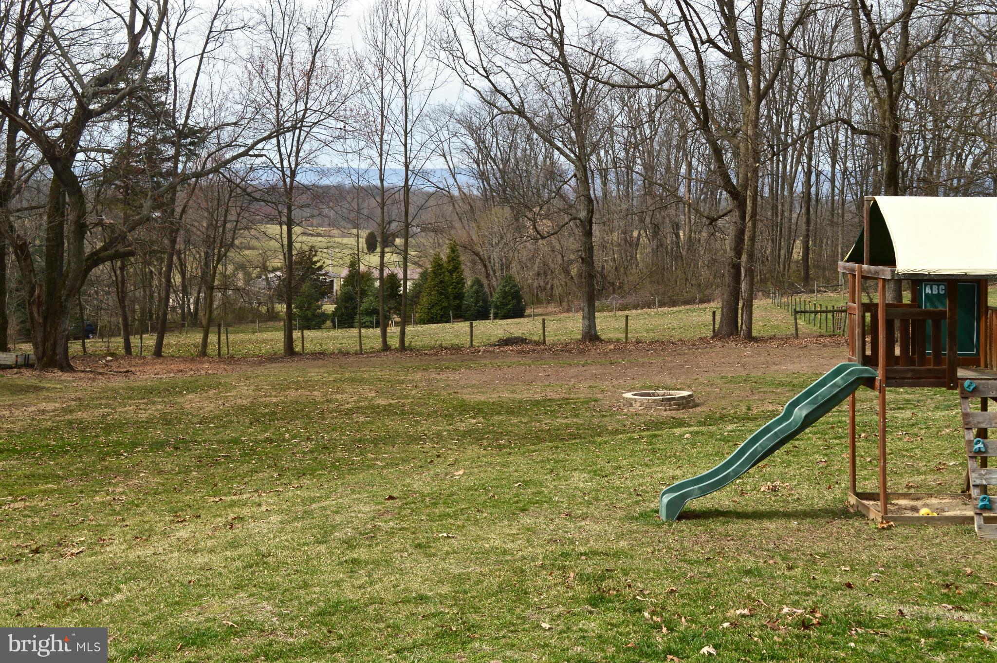 11812 Warner Road Keymar, MD 21757 - Photo 21 of 25 a view of a park with swings and slides