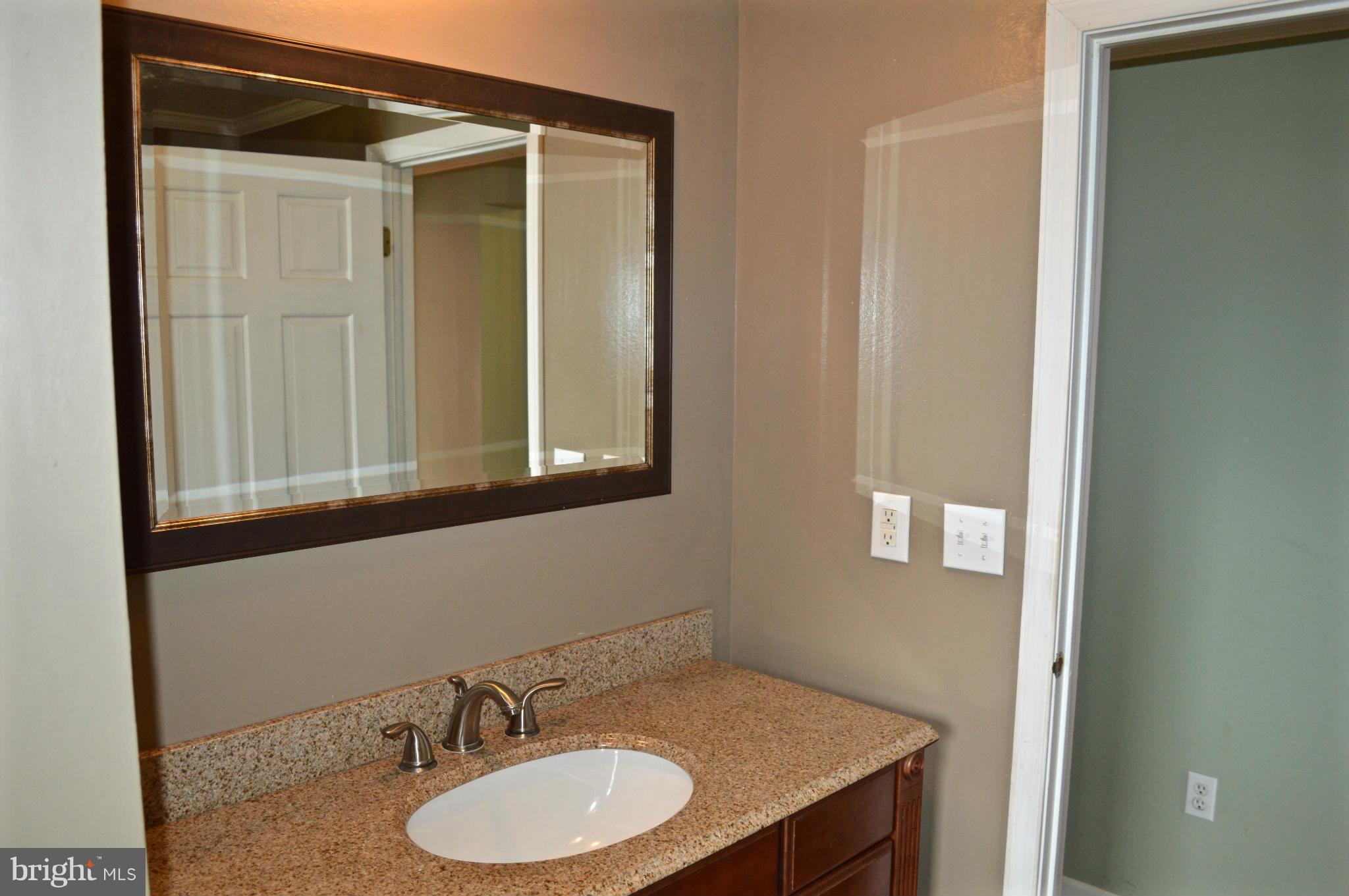 11812 Warner Road Keymar, MD 21757 - Photo 7 of 25 a bathroom with a sink and a mirror