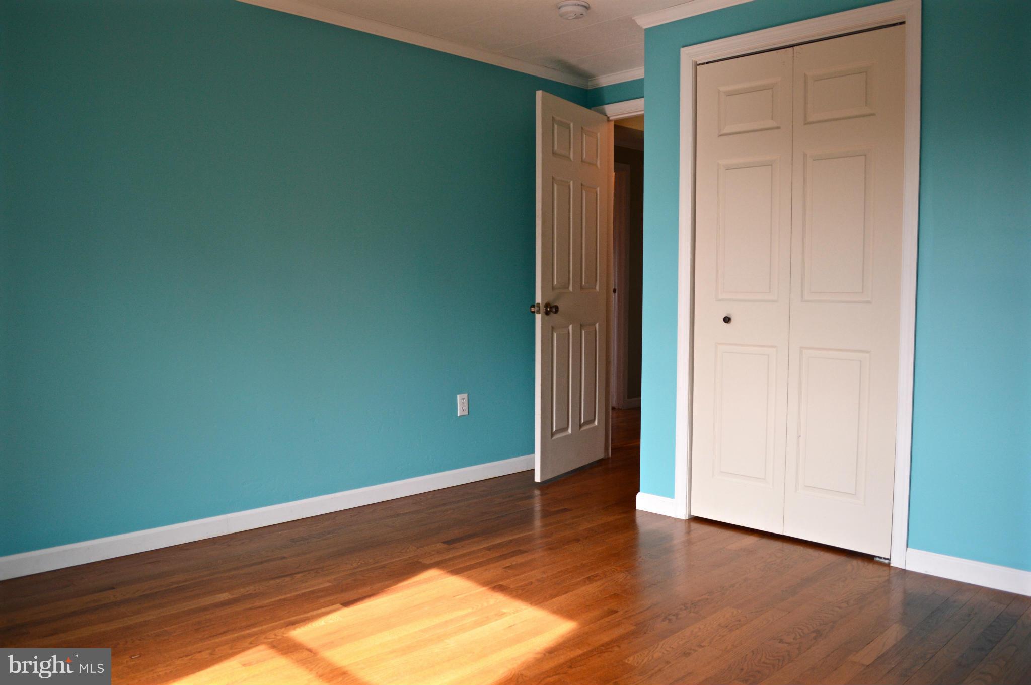 11812 Warner Road Keymar, MD 21757 - Photo 8 of 25 an empty room with wooden floor and closet