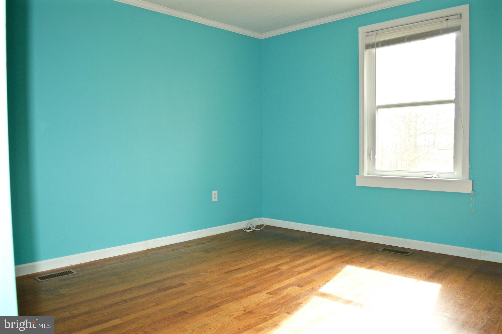 11812 Warner Road Keymar, MD 21757 - Photo 9 of 25 a view of a room with wooden floor and windows