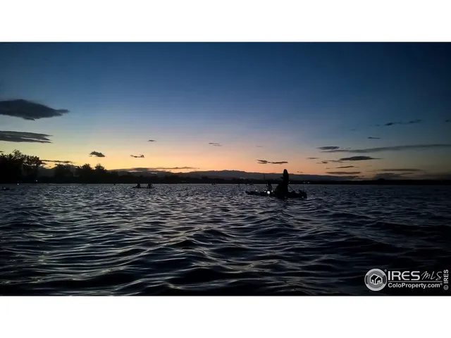 a view of a sign board with lake view