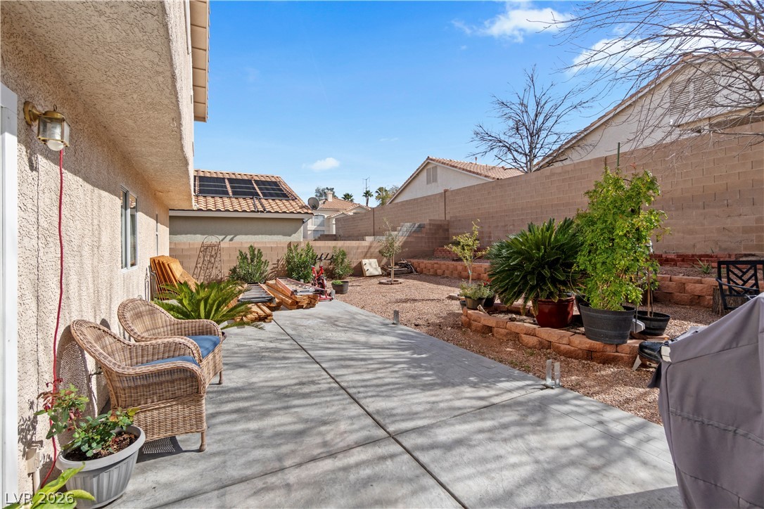 1419 Red Sunset Avenue Henderson, NV 89074 - Photo 32 of 35 Fenced backyard with a patio