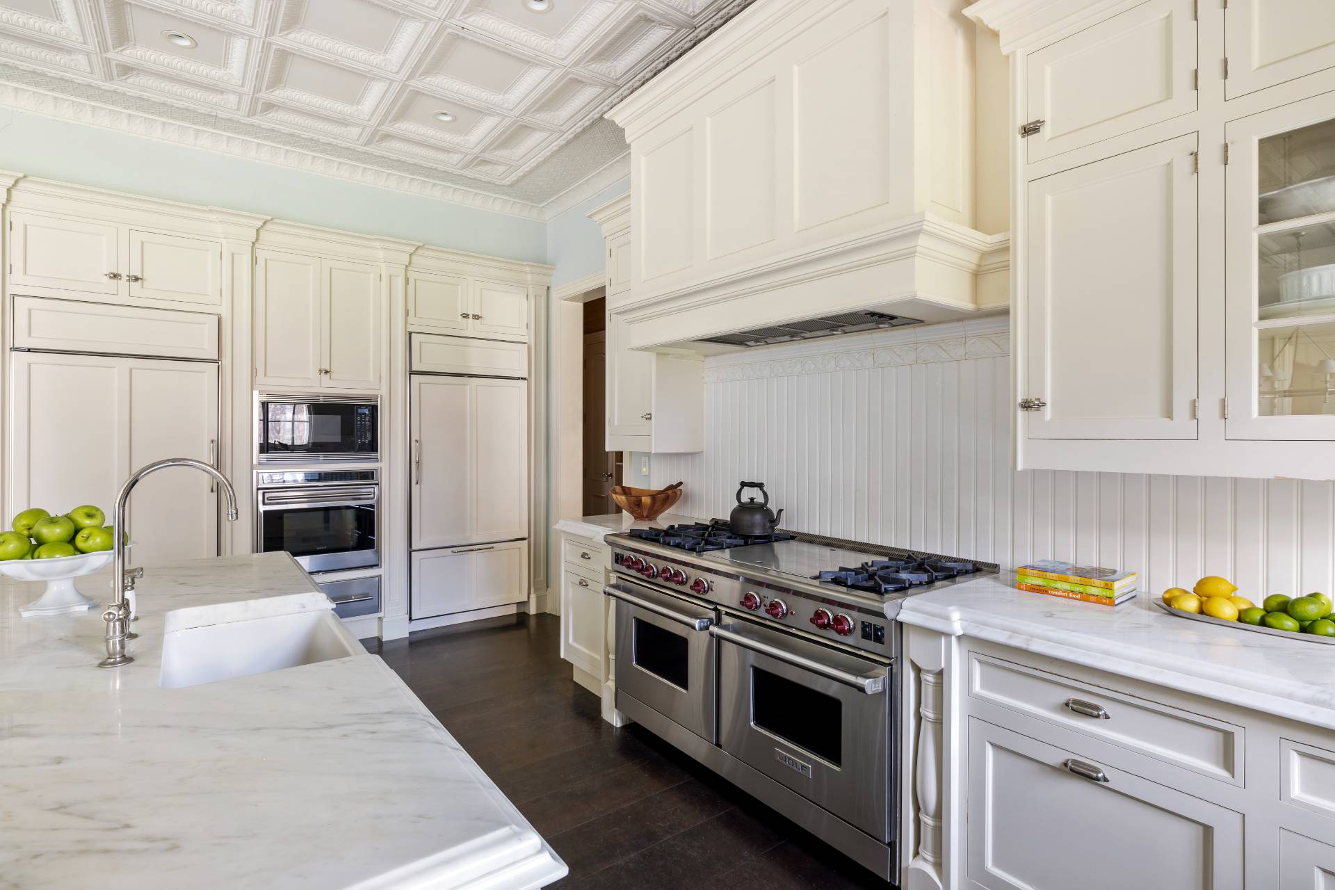 58 Wainscott Stone Road Wainscott, NY 11975 - Photo 11 of 48 a kitchen with stainless steel appliances granite countertop a stove a sink and a refrigerator