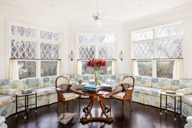 a view of a dining room with furniture window and outside view