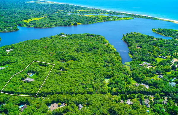 an aerial view of a house with a yard