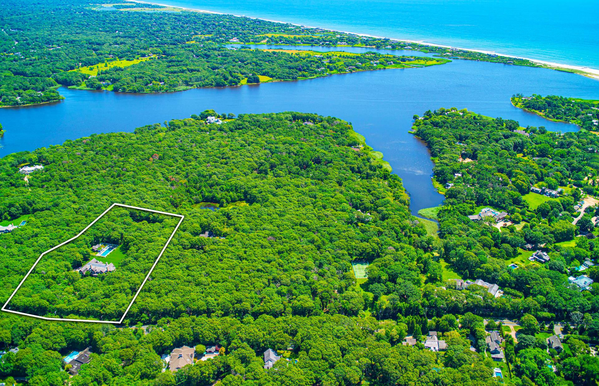 58 Wainscott Stone Road Wainscott, NY 11975 - Photo 2 of 48 an aerial view of a house with a yard