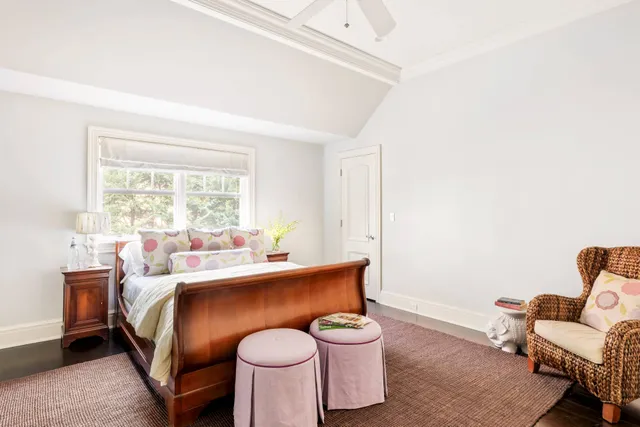 a bed room with a bed and a chair