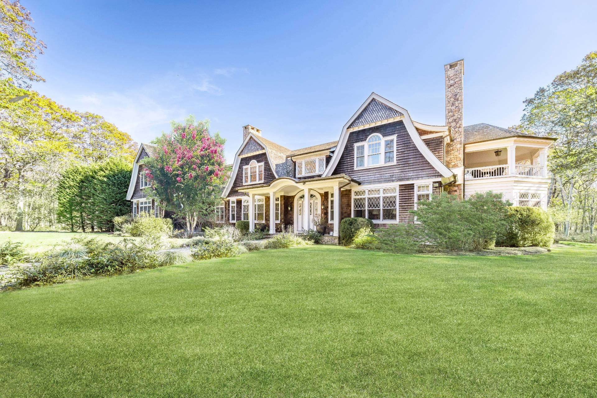 58 Wainscott Stone Road Wainscott, NY 11975 - Photo 4 of 48 a front view of a house with garden
